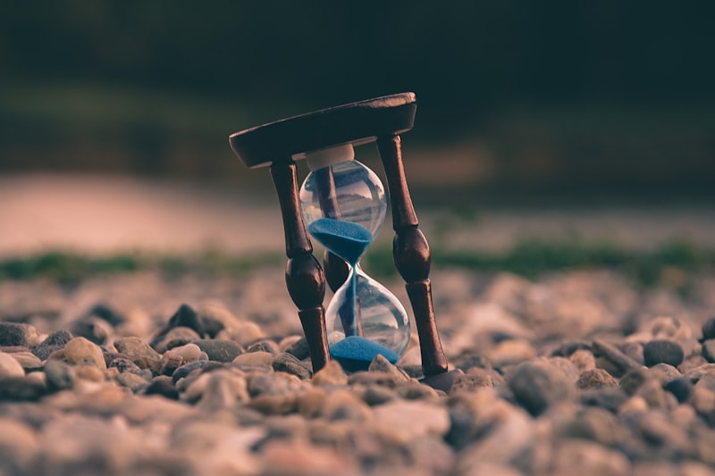 Hourglass with sand running through it